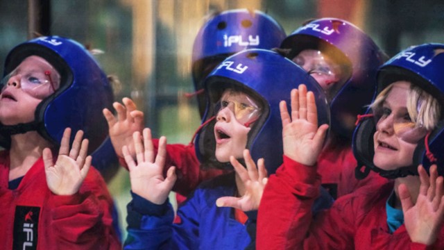 Children looking through the tunnel glass