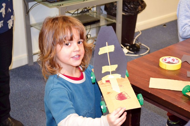 A boy with his sail-car