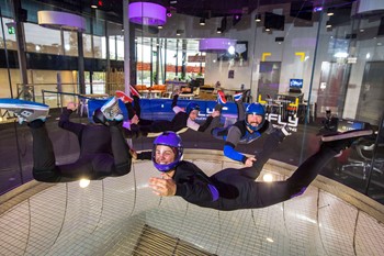 Four skydivers flying together