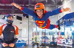 Superhero child flying at iFLY